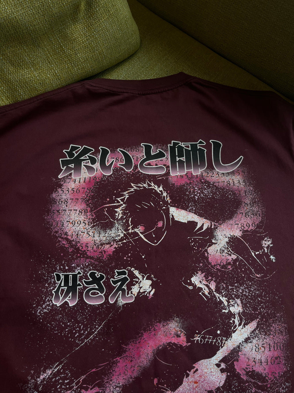 Itoshi Sae's Ego Kurse Mark oversized tee in black, showing a relaxed fit with graphic design on the front.