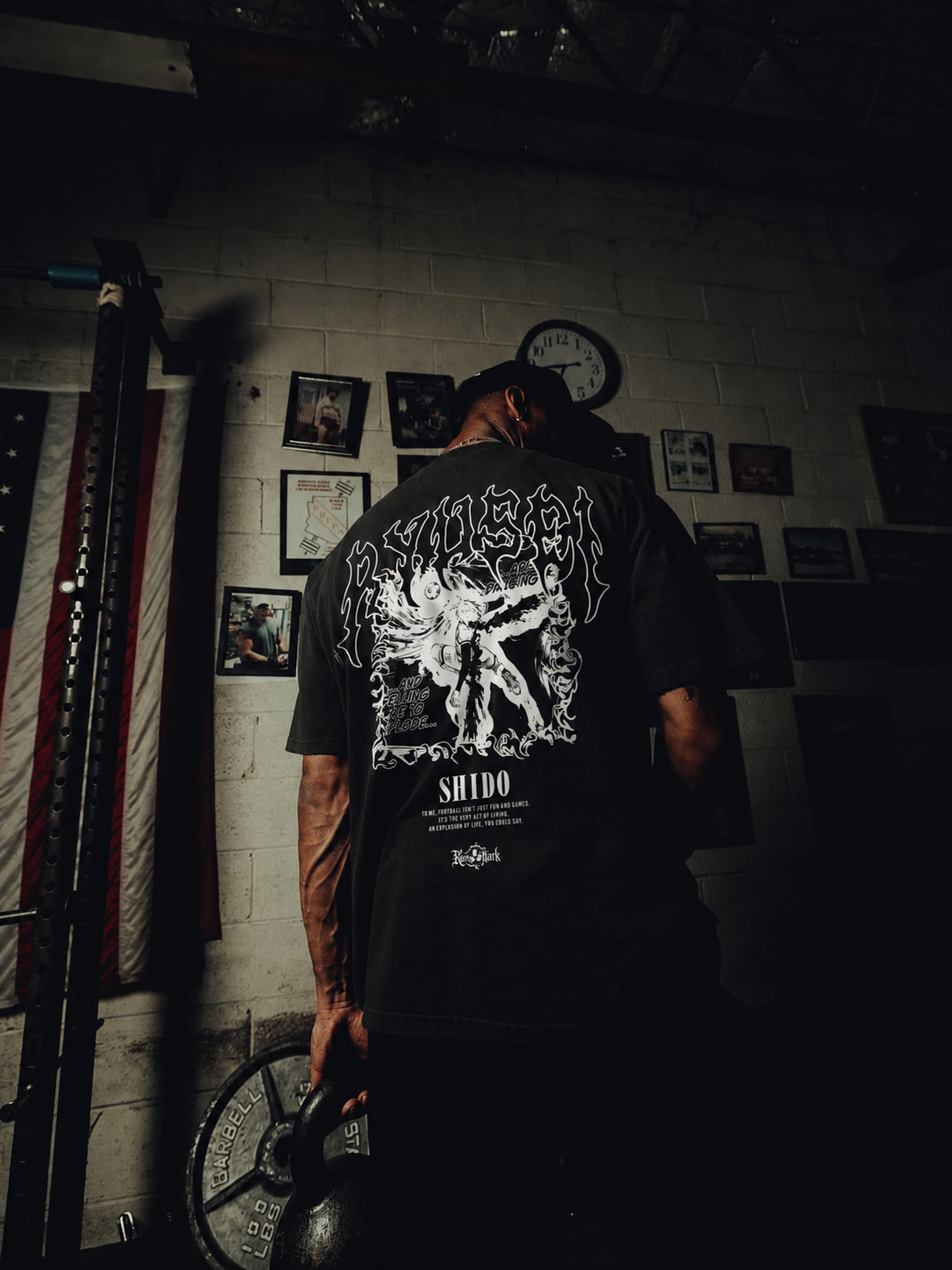 Black Shido Ryusei's Ego Kurse Mark Tee featuring a graphic design, casual fit, and Kurse Mark branding on the front.