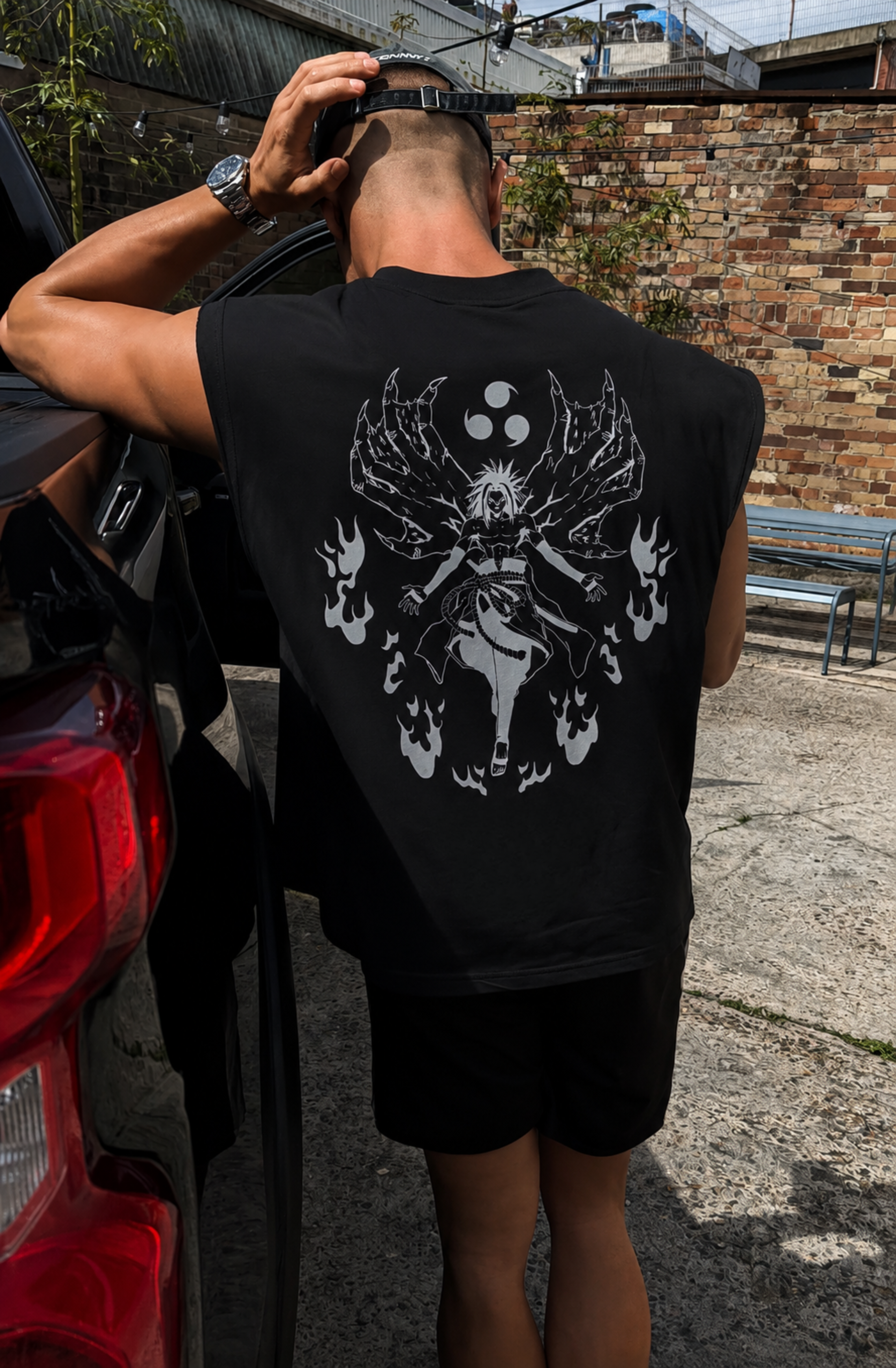 Black Sasuke's Kursed tank top from PODpartner featuring bold graphic design and comfortable sleeveless fit.