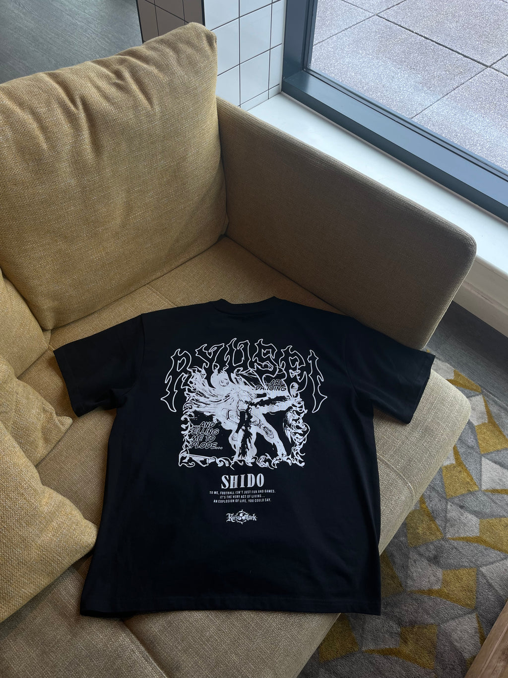 Kurse Mark Shido Ryusei's Ego Kurse Mark Tee featuring a casual fit with graphic design on soft fabric.