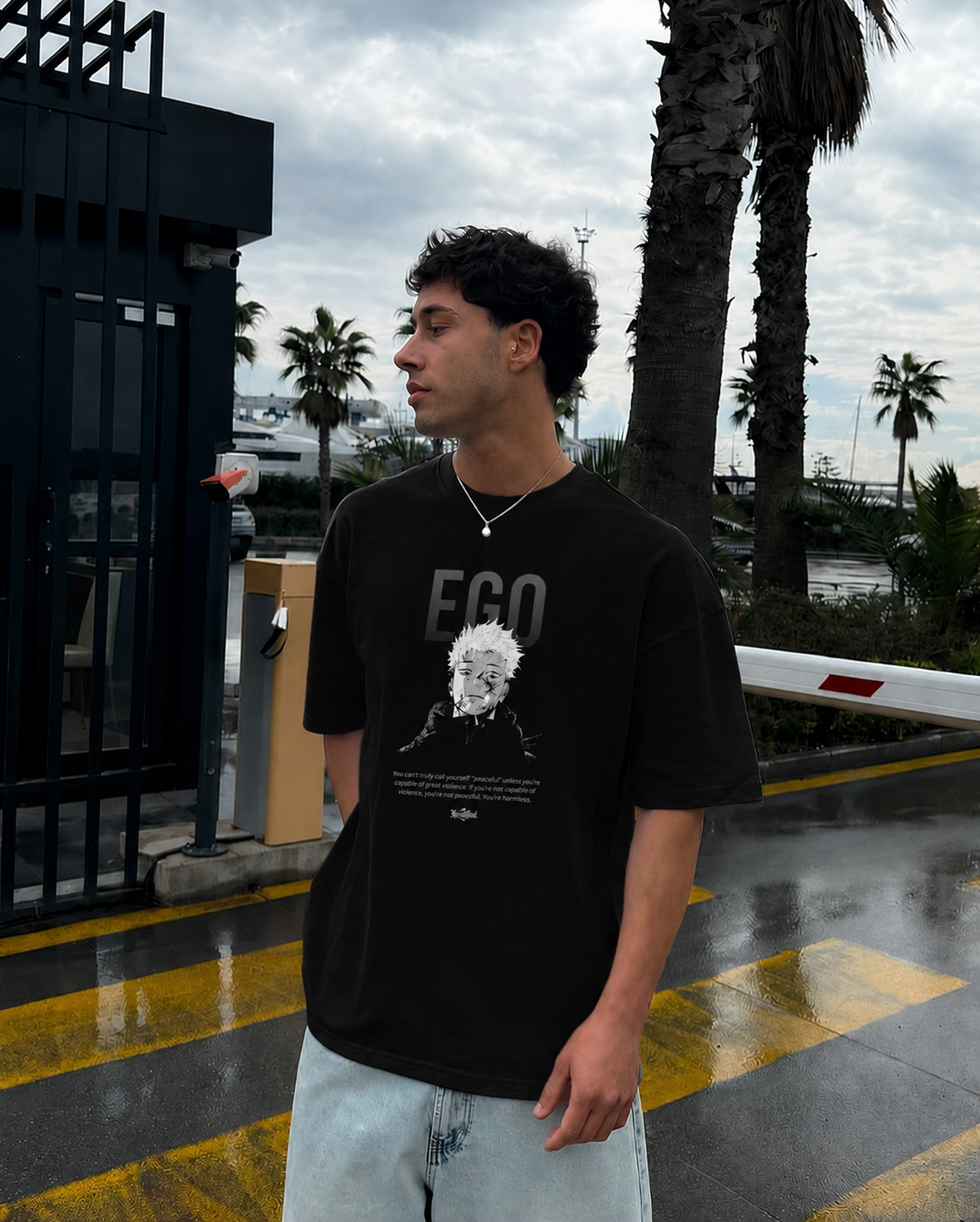 Black PODpartner Yuji's Ego Kurse Mark Tee featuring bold graphic design on soft cotton fabric.