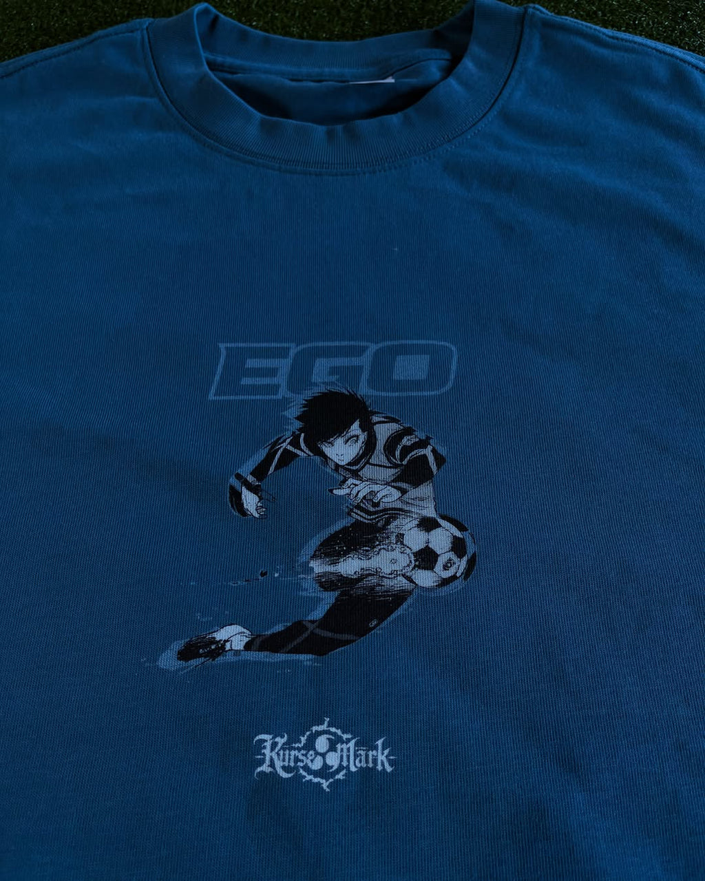 Kurse Mark Rin's Ego Kurse Mark Tee displayed with a clean, casual fit and bold graphic design on soft cotton fabric.