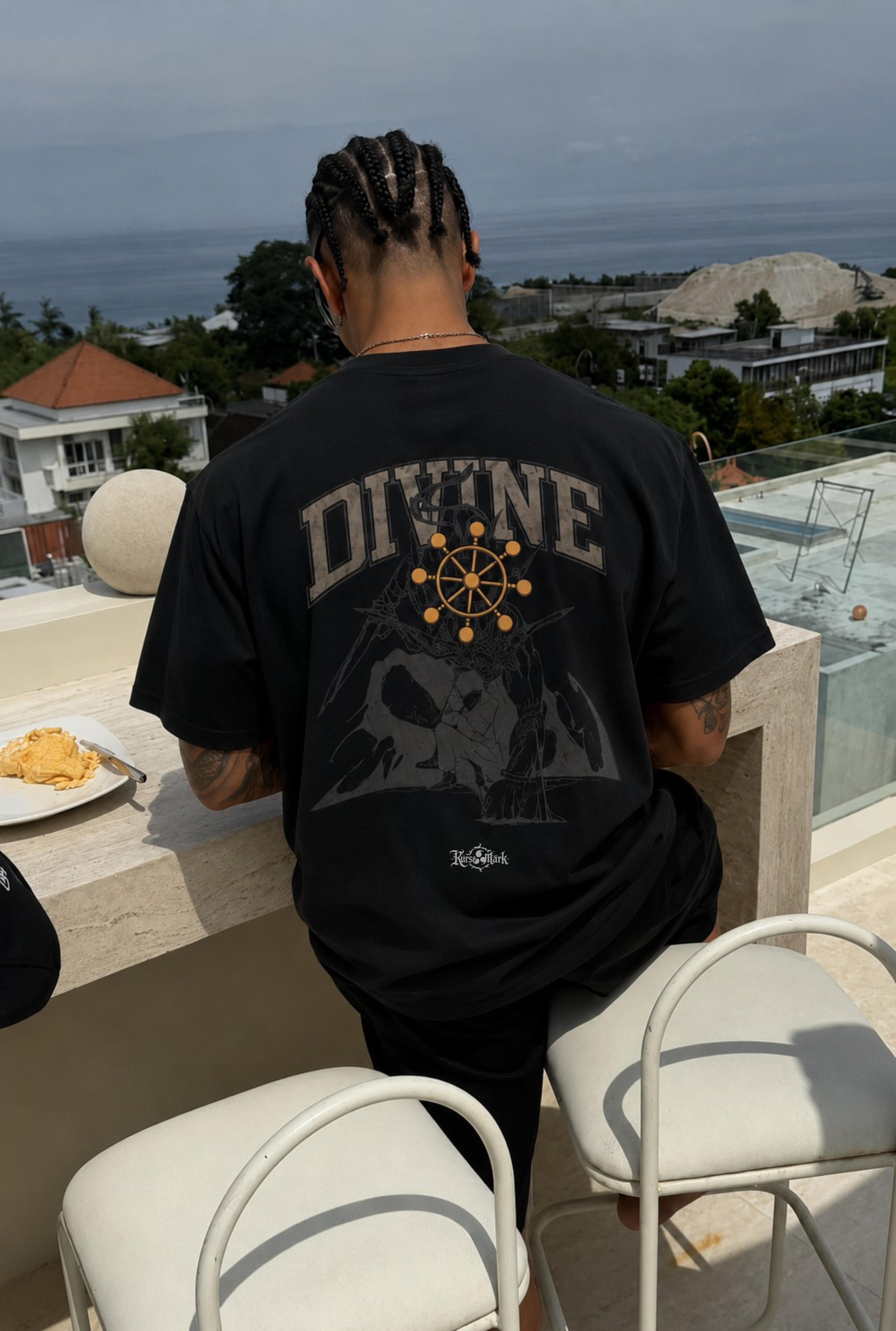 Kurse Mark Megumi's Divine Treasure Kurse Mark Tee, black cotton graphic t-shirt with colorful design on front.